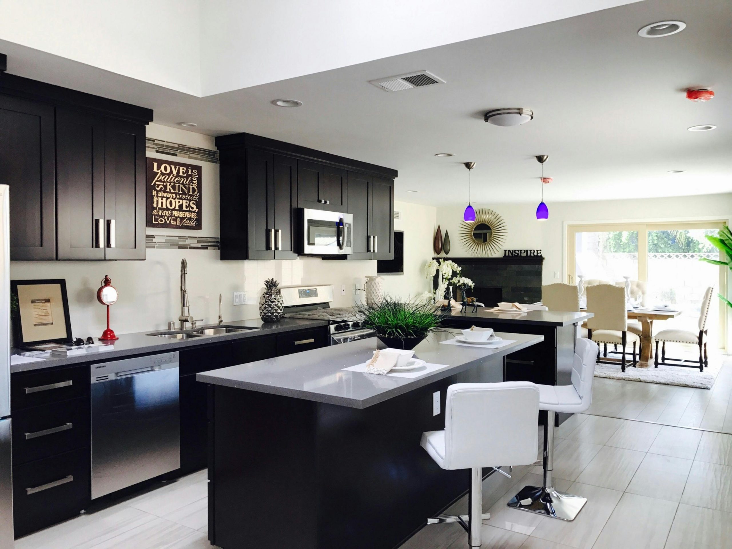 modern kitchen with black countertops and high-tech appliances